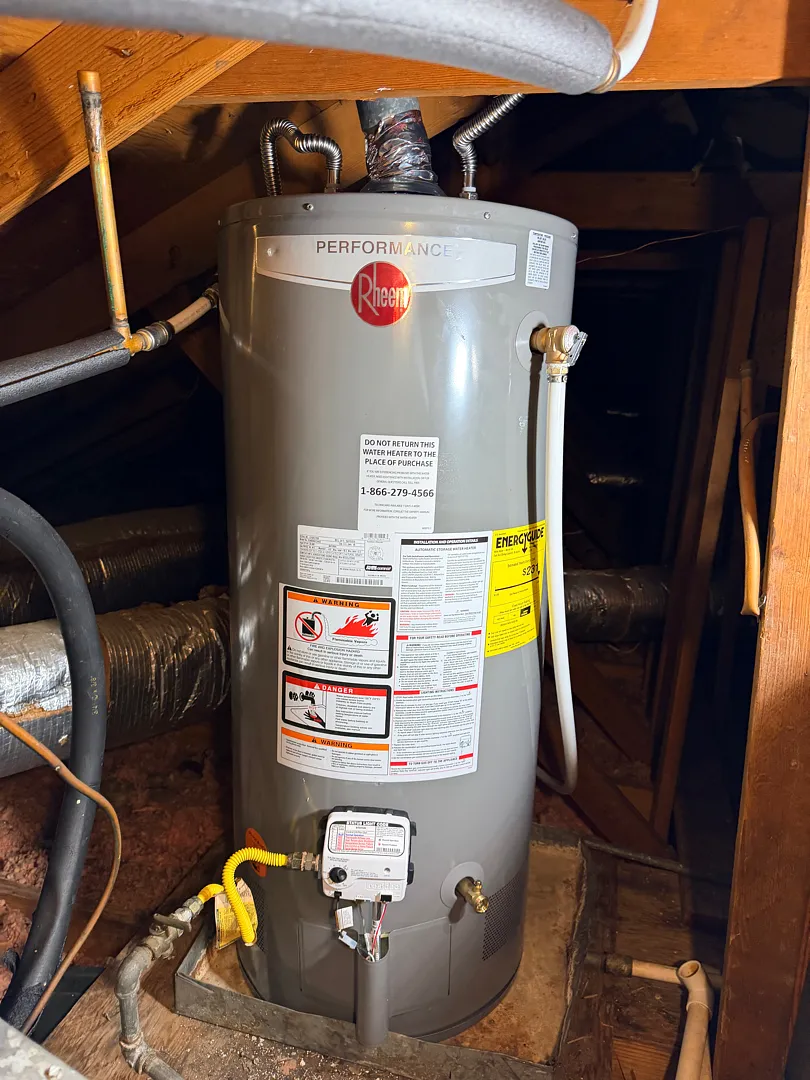 Rheem gas storage water heater installed in an attic space